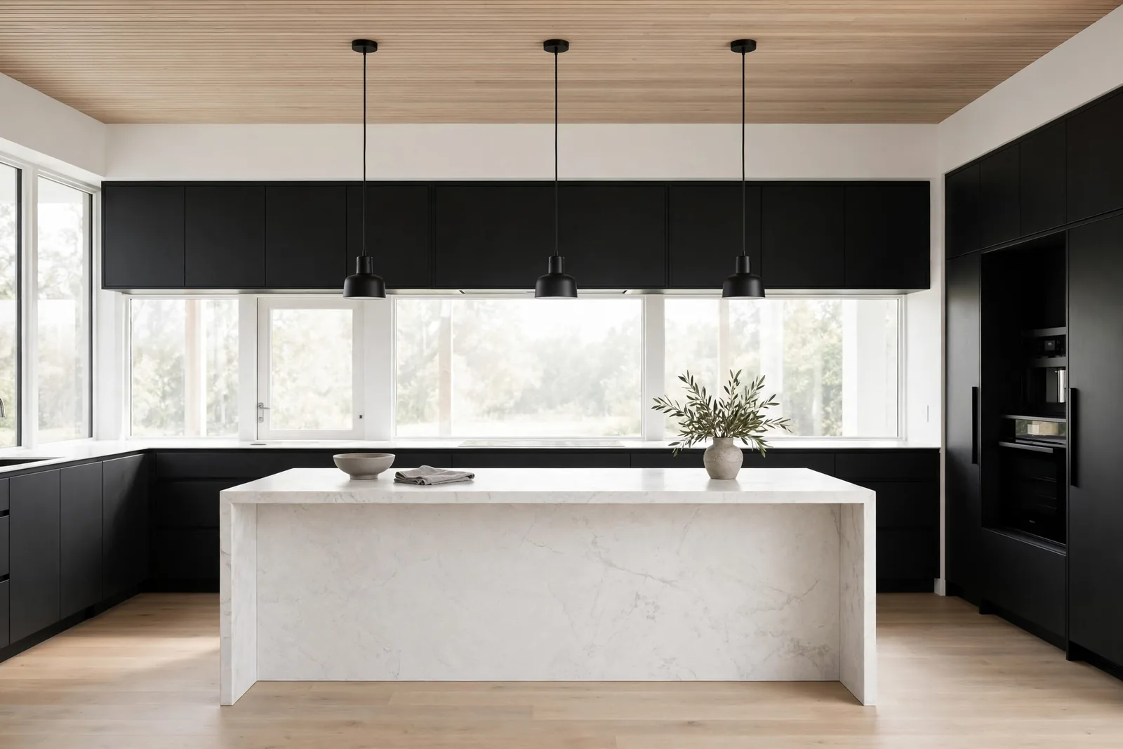 A minimal black and white kitchen